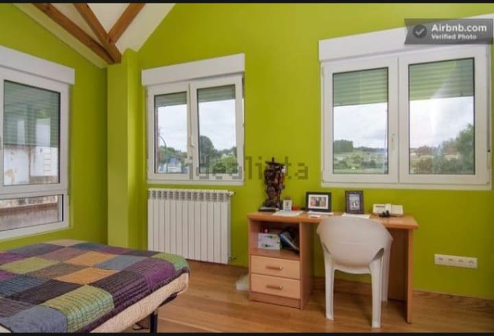 Dormitorio verde en Villa Marina